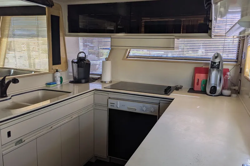 Slide: The Image of Modern kitchen interior of 1992 Viking 65 Motor Yacht with appliances and ample counter space. - 23