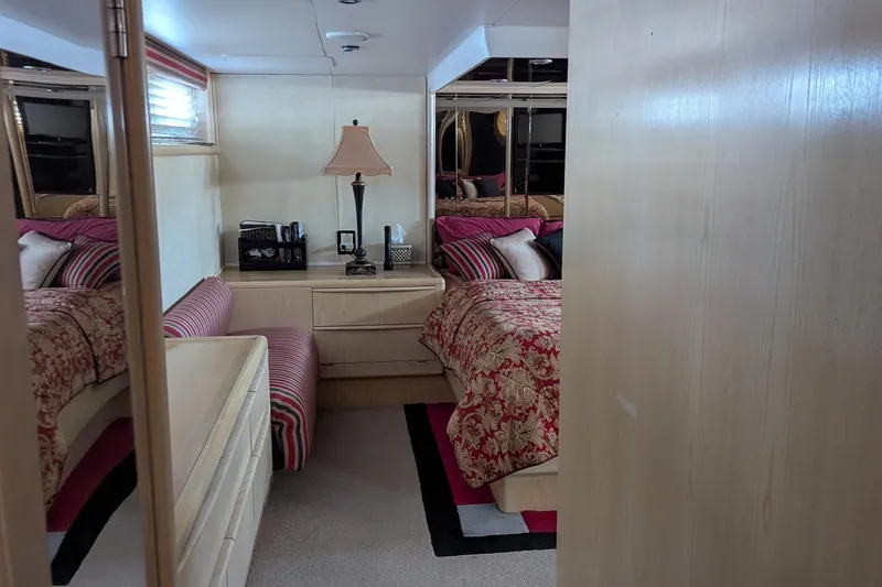 Slide: The Image of Luxurious bedroom interior of 1992 Viking 65 Motor Yacht with elegant decor and furnishings. - 24