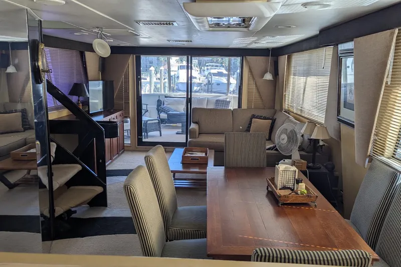 Slide: The Image of Luxurious interior of a 1992 Viking 65 Motor Yacht with elegant furnishings and ample natural light. - 25