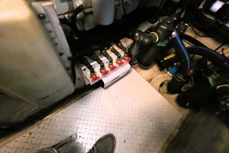 Slide: The Image of Engine room of a 1999 Sea Ray Sundancer 540 with visible mechanical components. - 17