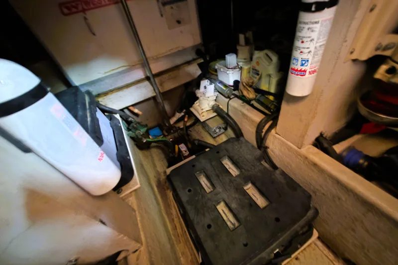 Slide: The Image of Engine room of a 1999 Sea Ray Sundancer 540 with various mechanical components. - 18