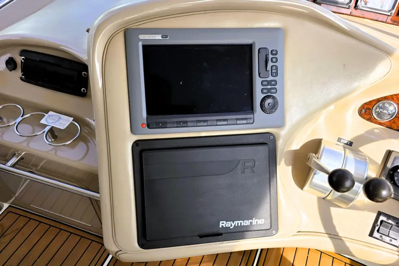 Slide: The Image of Control panel of a 1999 Sea Ray Sundancer 540 with Raymarine navigation system. - 25