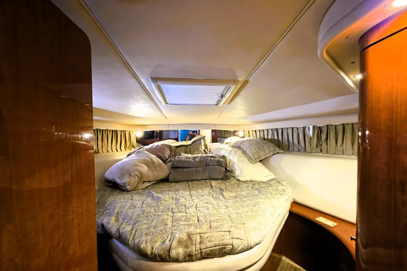 Slide: The Image of Luxurious cabin interior of 1999 Sea Ray Sundancer 540 yacht with cozy bedding. - 5