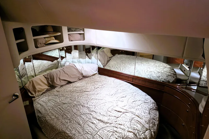 Slide: The Image of Luxurious bedroom interior of 1999 Sea Ray Sundancer 540 yacht with mirrored walls. - 6