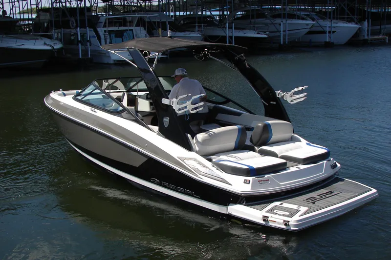 The Image of 2017 Regal 2300 RX Surf boat on water, featuring sleek design and comfortable seating. - 1