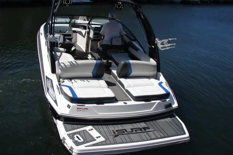Slide: The Image of 2017 Regal 2300 RX Surf boat on water, featuring spacious seating and sleek design. - 11