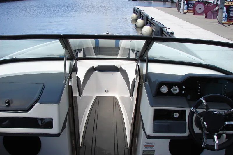 Slide: The Image of Interior view of a 2017 Regal 2300 RX Surf boat at a dock. - 21
