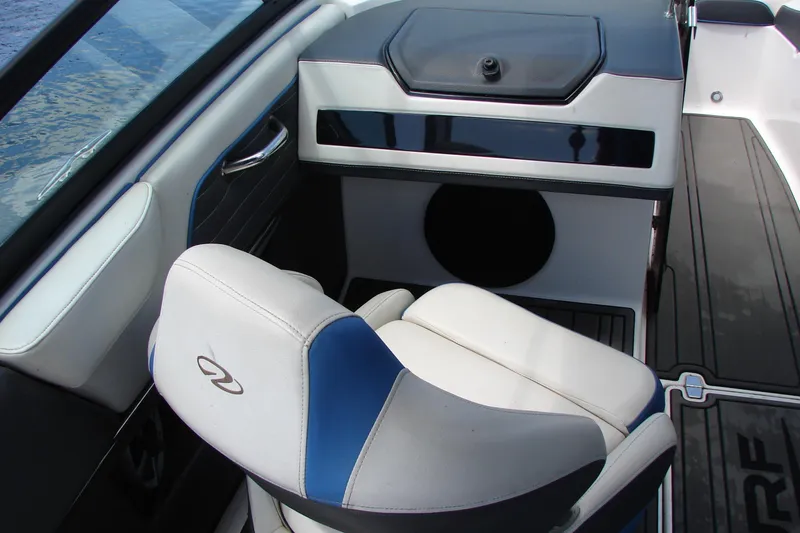 Slide: The Image of Interior of 2017 Regal 2300 RX Surf boat with white and blue seating. - 23