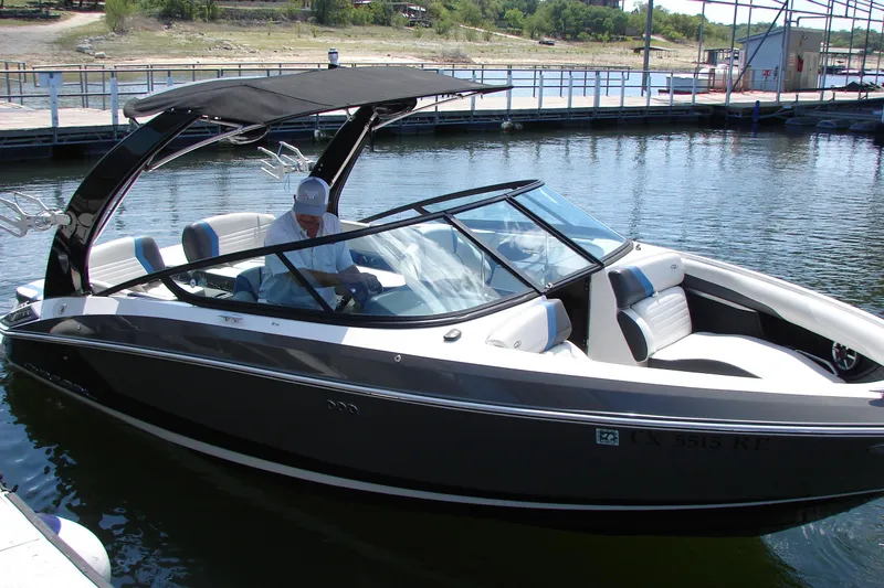 Slide: The Image of 2017 Regal 2300 RX Surf boat docked on a sunny day. - 9