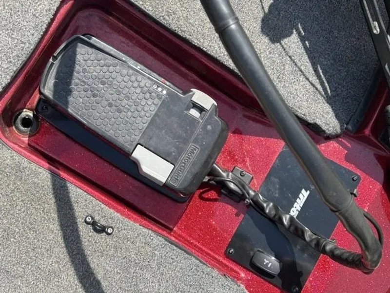 Slide: The Image of Triton 17 Explorer 2011 boat pedal on red deck. - 13