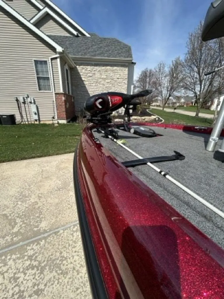 Slide: The Image of 2011 Triton 17 Explorer boat parked on driveway. - 14