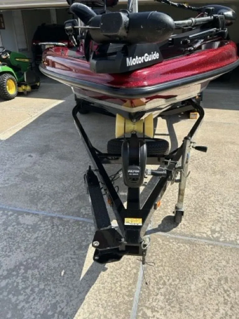 Slide: The Image of 2011 Triton 17 Explorer boat on trailer in driveway. - 16