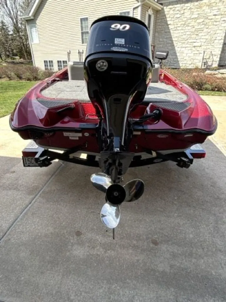 Slide: The Image of Red 2011 Triton 17 Explorer boat with outboard motor. - 19