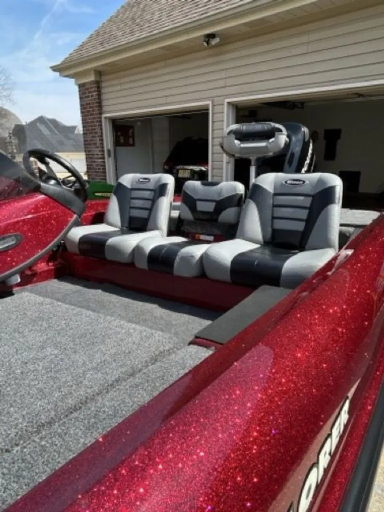 Slide: The Image of 2011 Triton 17 Explorer boat with red glitter seats. - 2