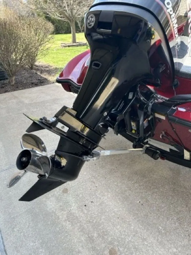 Slide: The Image of 2011 Triton 17 Explorer outboard motor on concrete surface. - 20