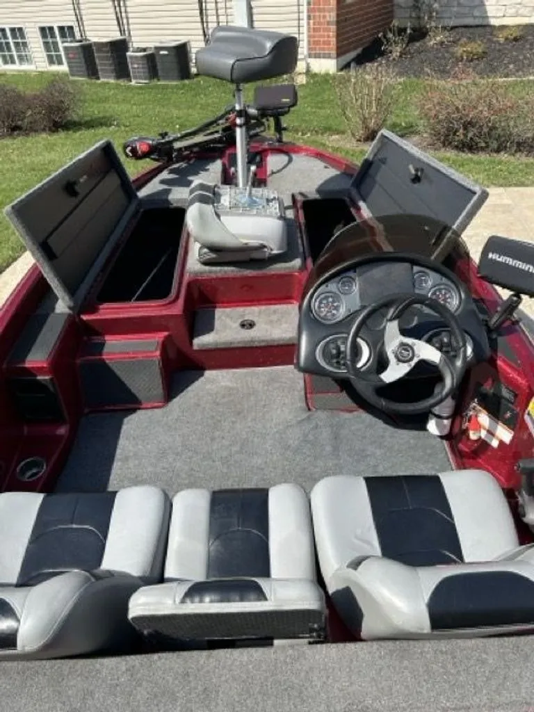 Slide: The Image of Interior view of a 2011 Triton 17 Explorer boat with steering console. - 3