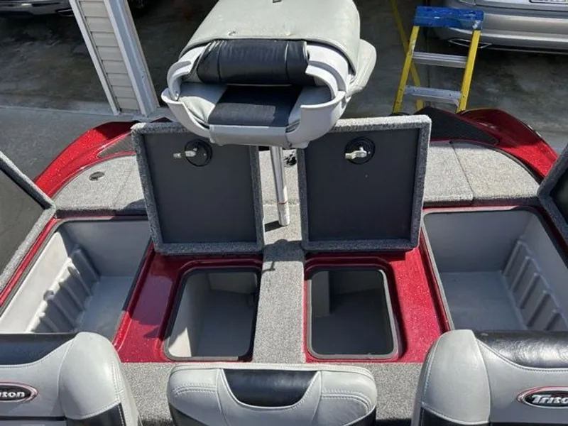 Slide: The Image of 2011 Triton 17 Explorer boat with open storage compartments. - 8