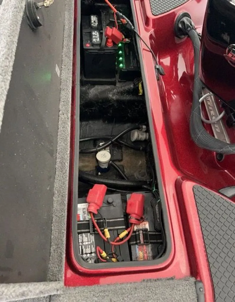 Slide: The Image of Battery compartment of a 2011 Triton 17 Explorer boat with cables. - 9