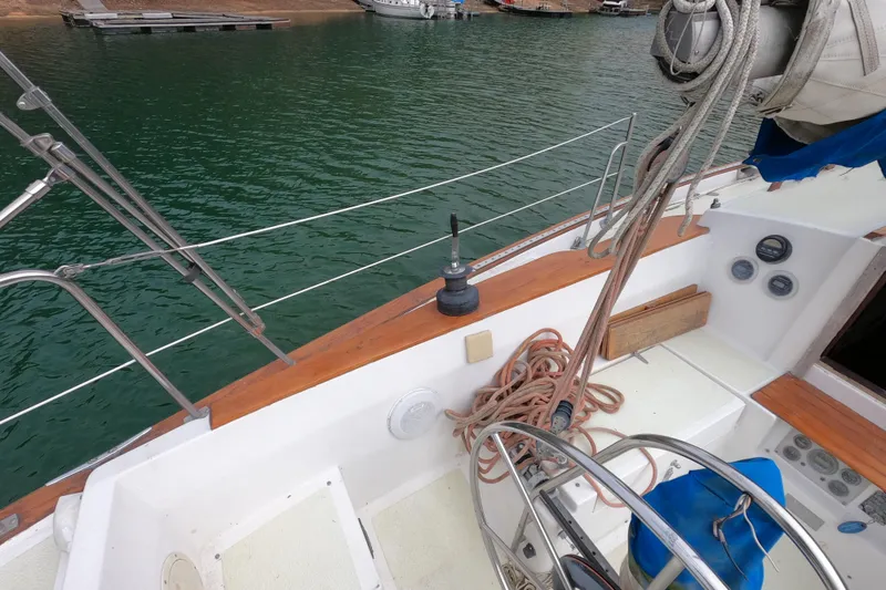 Slide: The Image of Cockpit of a 1980 Morgan 382 sailboat with ropes and steering wheel. - 6