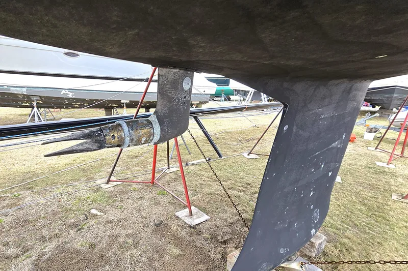 Slide: The Image of Underwater view of a 2004 C&C 121 sailboat's keel and propeller on land. - 10