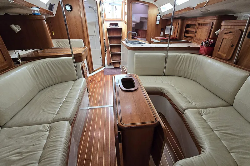 Slide: The Image of Luxurious 2004 C&C 121 yacht interior with elegant wood finish and comfortable seating. - 3