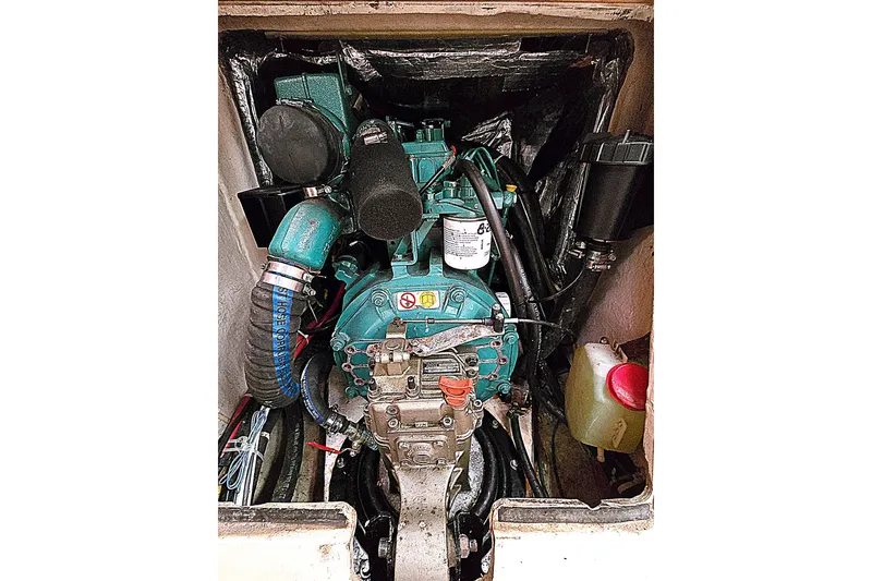 Slide: The Image of Engine compartment of a 2004 C&C 121 sailboat, showcasing detailed mechanical components. - 9
