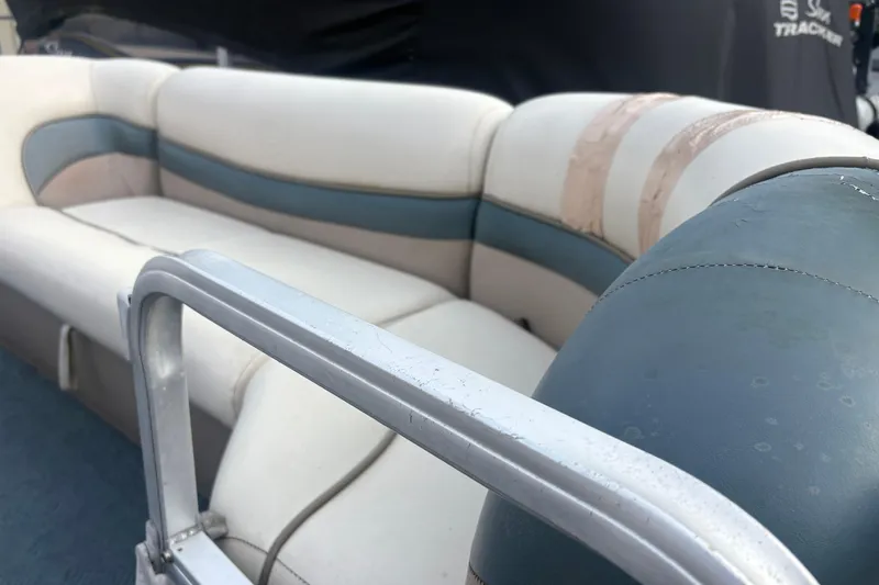 Slide: The Image of 2004 Sun Tracker Party Barge 22 Regency Edition with worn blue and white seating. - 13