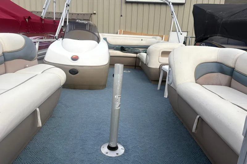 Slide: The Image of 2004 Sun Tracker Party Barge 22 Regency Edition with spacious seating and blue carpeted deck. - 8