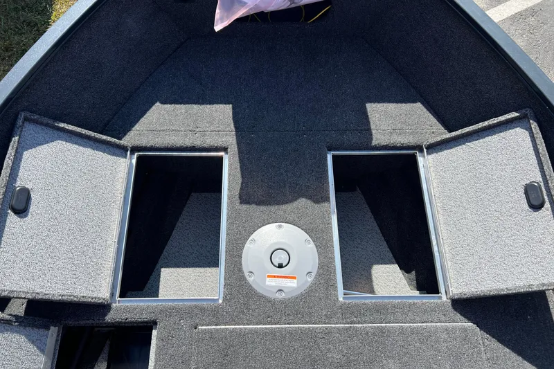 Slide: The Image of 2026 Crestliner 1650 Kodiak boat interior with open storage compartments. - 7