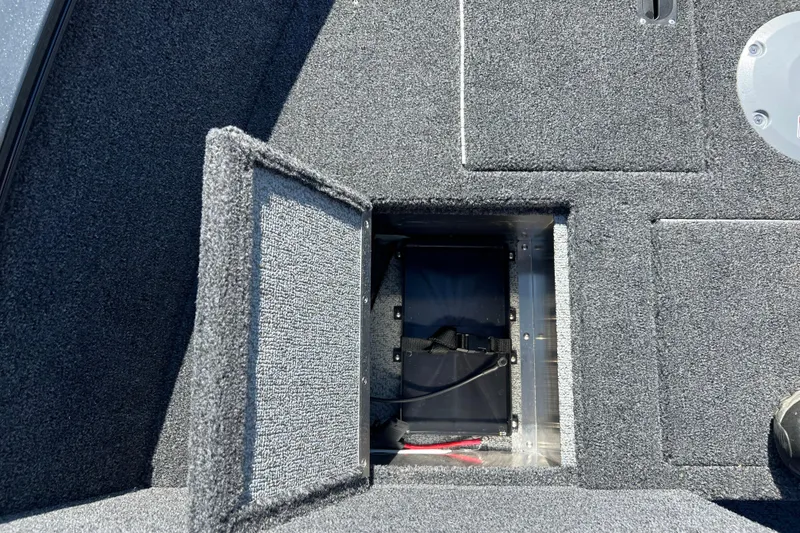 Slide: The Image of Open storage compartment on 2026 Crestliner 1650 Kodiak boat deck. - 8