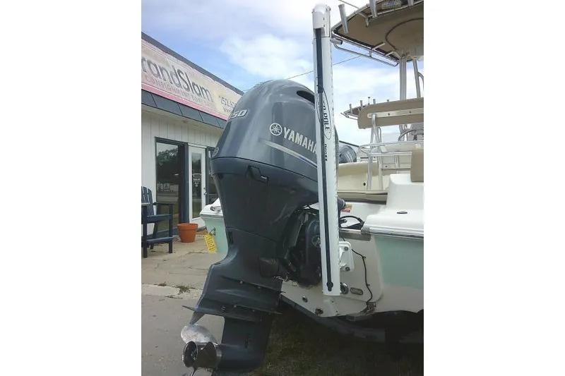 Slide: The Image of 2017 Key West 203 FS boat with Yamaha outboard motor displayed outdoors. - 10