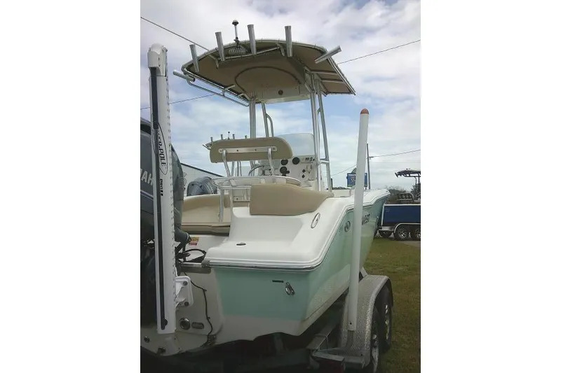 Slide: The Image of 2017 Key West 203 FS boat on trailer, featuring center console and T-top. - 11