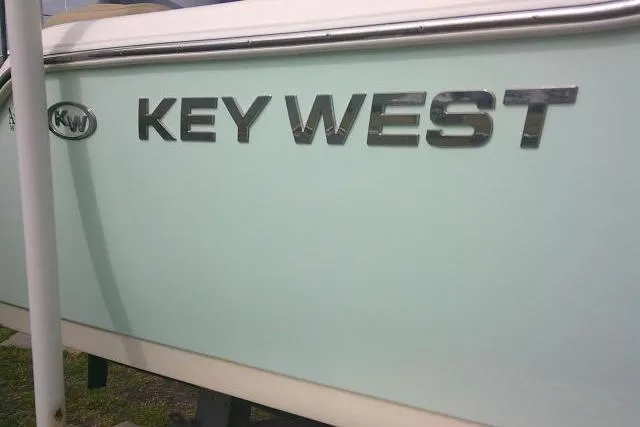 Slide: The Image of 2017 Key West 203 FS boat side view with logo. - 12