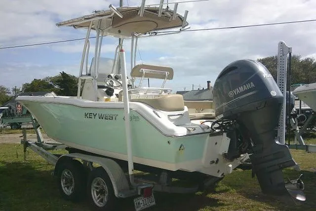 Slide: The Image of 2017 Key West 203 FS boat with Yamaha outboard motor on trailer. - 13