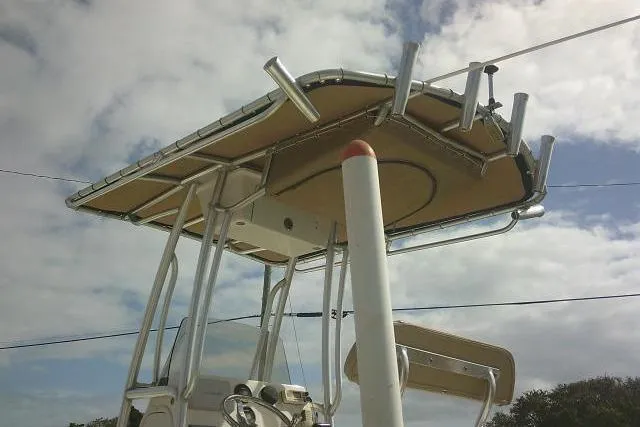 Slide: The Image of 2017 Key West 203 FS boat with T-top against cloudy sky. - 14