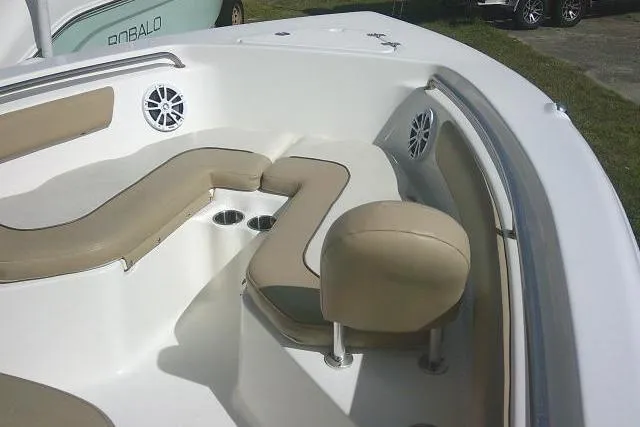 Slide: The Image of 2017 Key West 203 FS boat interior with beige seating and cup holders. - 22