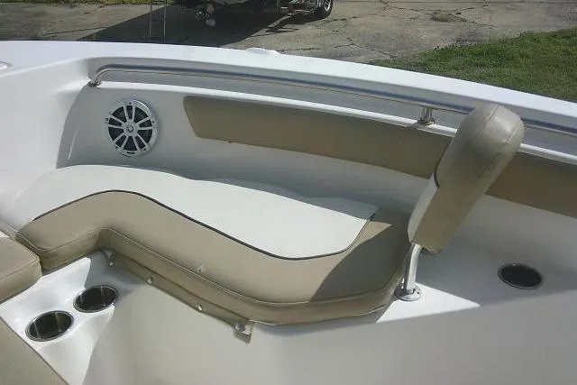 Slide: The Image of 2017 Key West 203 FS boat interior with cushioned seating and cup holders. - 24