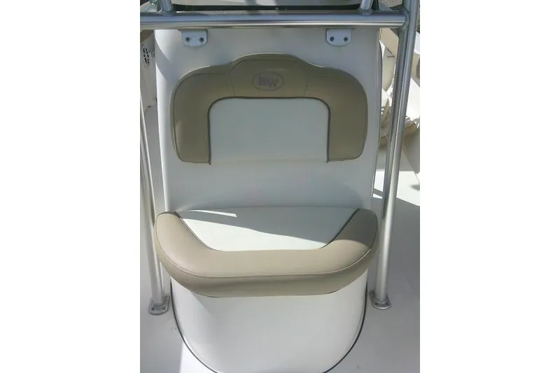 Slide: The Image of 2017 Key West 203 FS boat seat with beige upholstery and stainless steel frame. - 25