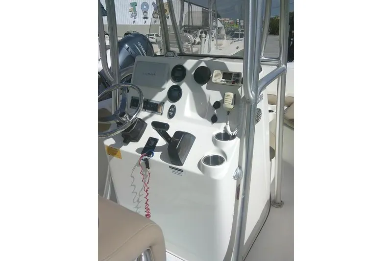 Slide: The Image of 2017 Key West 203 FS boat console with steering wheel and controls. - 31