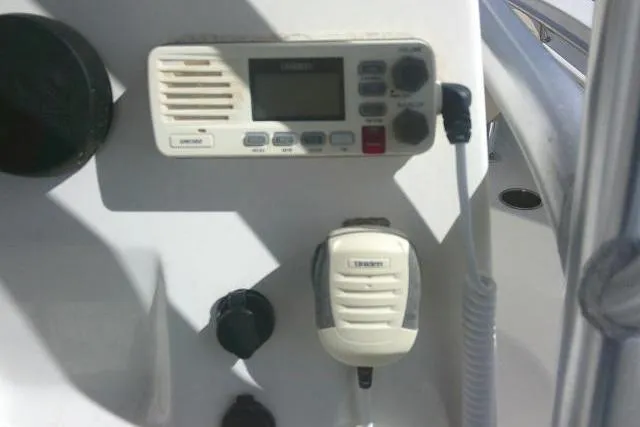 Slide: The Image of 2017 Key West 203 FS boat dashboard with radio and microphone controls. - 32