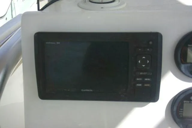 Slide: The Image of Console of a 2017 Key West 203 FS boat featuring a Garmin GPS display. - 33