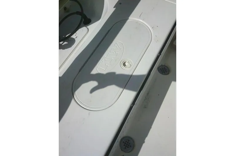 Slide: The Image of 2017 Key West 203 FS boat deck with storage compartment and drainage features. - 35