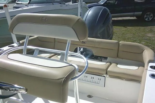 Slide: The Image of 2017 Key West 203 FS boat interior with beige seating and measuring scale. - 49