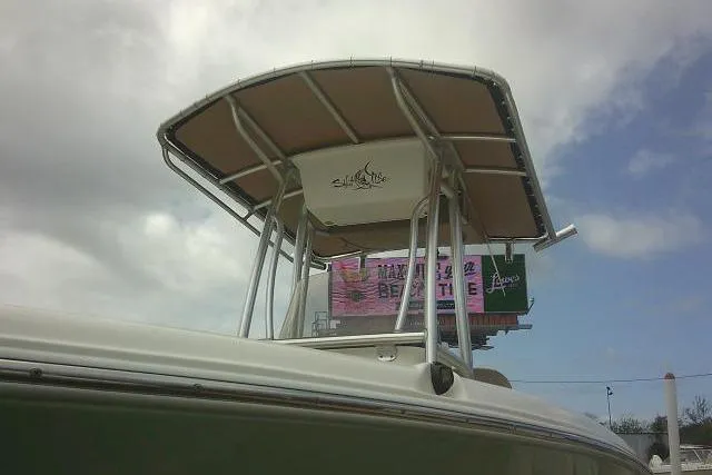 Slide: The Image of 2017 Key West 203 FS boat with T-top against cloudy sky background. - 5
