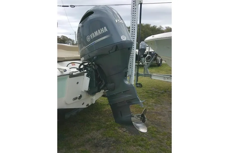Slide: The Image of 2017 Key West 203 FS boat with Yamaha 150 outboard motor displayed outdoors. - 8