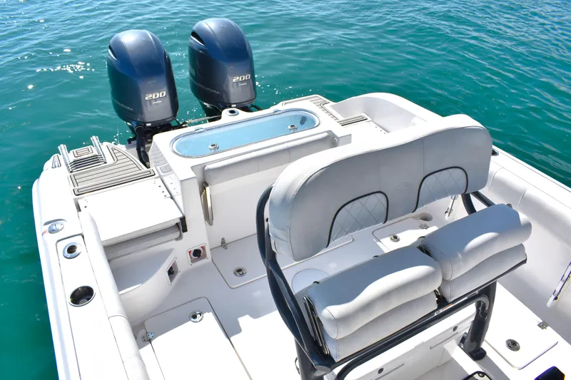 Slide: The Image of 2020 Sea Fox 266 Commander boat with dual engines on clear water. - 19