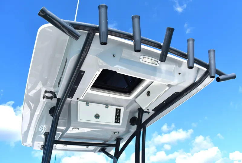 Slide: The Image of Sea Fox 266 Commander 2020 T-top with rod holders against blue sky. - 22