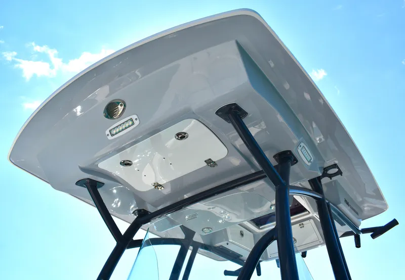 Slide: The Image of 2020 Sea Fox 266 Commander boat T-top against clear blue sky. - 23