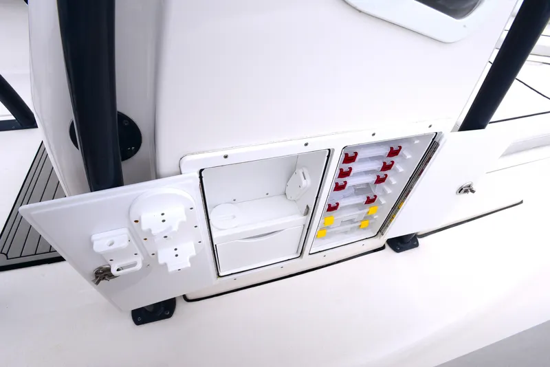 Slide: The Image of 2020 Sea Fox 266 Commander boat control panel with switches and storage. - 26