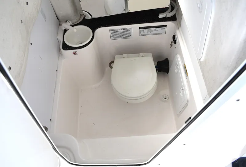 Slide: The Image of 2020 Sea Fox 266 Commander boat interior with compact marine toilet. - 27